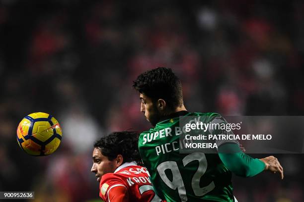 Benfica's Croatian midfielder Filip Krovinovic vies with Sporting's Italian defender Cristiano Piccini during the Portuguese league football match SL...