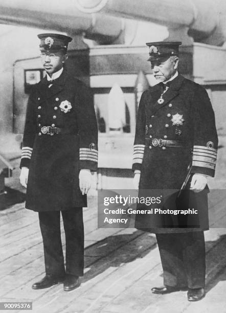 Crown Prince Hirohito of Japan with Fleet-Admiral Heihachiro Togo on the deck of the Japanese flagship Mikasa, during a review of the Japanese fleet,...