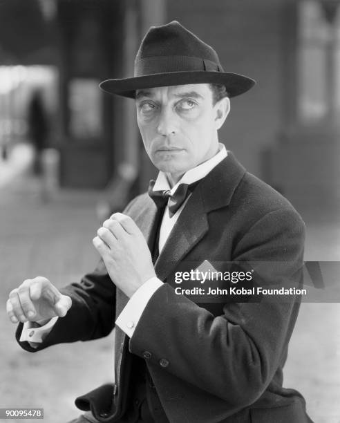 American silent screen comedian and actor Buster Keaton dressed as a man about town, 16th May 1932.