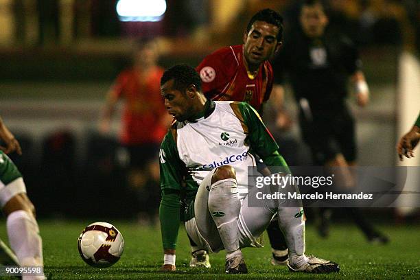 Mario Aravena of Chile's Union Espanola vies for the ball with Hugo Soto of Colombia's La Equidad during their 2009 Copa Sudamericana soccer match at...