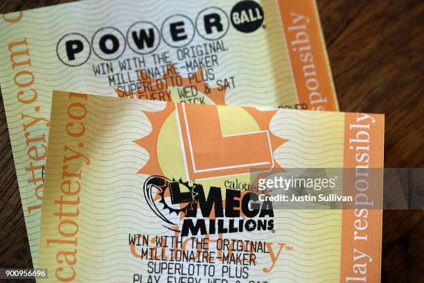 Powerball and Mega Millions lottery tickets are displayed on January 3, 2018 in San Anselmo, California. The Powerball jackpot and Mega Millions...