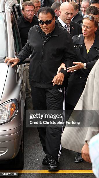 Boxing legend Muhammad Ali aided by his wife Lonnie arrives at Ricky Hatton's gym as part of his Uk charity tour on August 26, 2009 in Manchester,...
