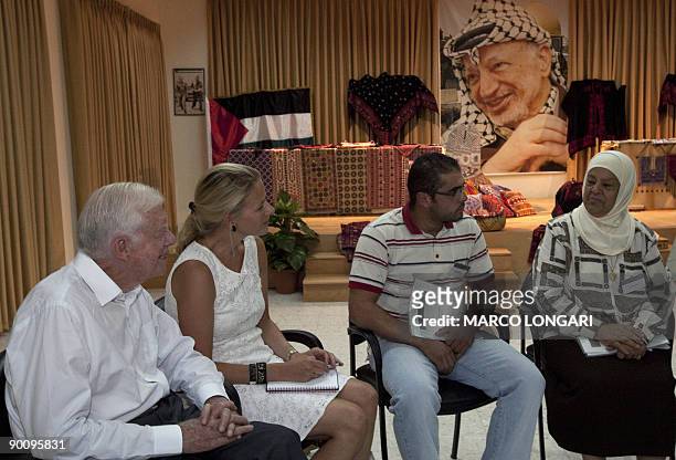 Former US president Jimmy Carter , sits along other members of �The Elders� , during a meeting with Palestinian women from an art craft center at the...