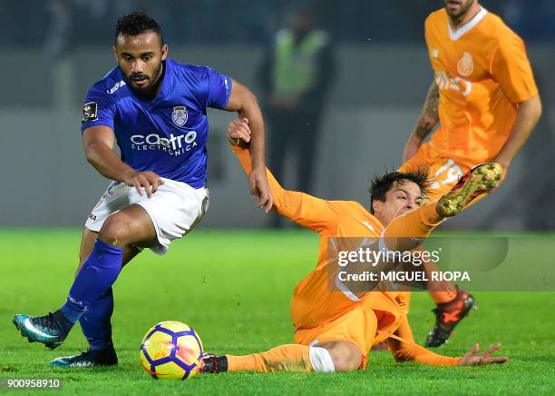 Porto's Spanish midfielder Oliver Torres vies with Feirense's Brazilian forward Edson Farias during the Portuguese league football match CD Feirense...