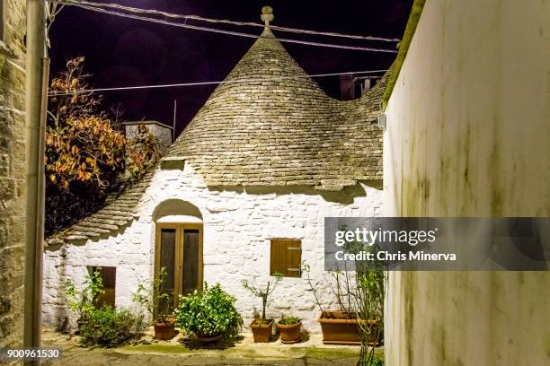 trullo residence in alberobello at night - trullo house stock pictures, royalty-free photos & images