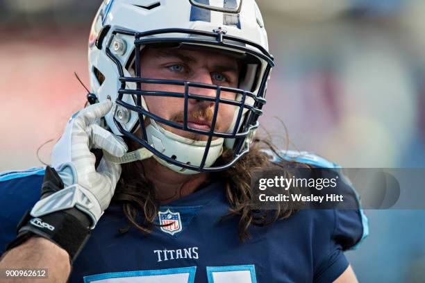 Dennis Kelly of the Tennessee Titans warms up before a game against the Jacksonville Jaguars at Nissan Stadium on December 31, 2017 in Nashville,...