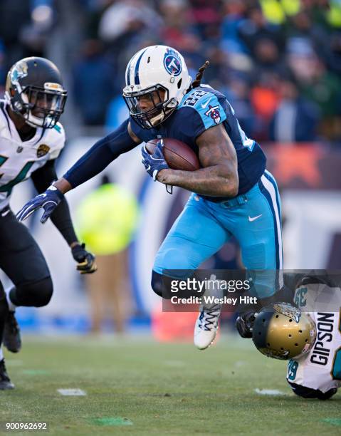 Derrick Henry of the Tennessee Titans is grabbed at the ankles by Tashaun Gipson of the Jacksonville Jaguars at Nissan Stadium on December 31, 2017...