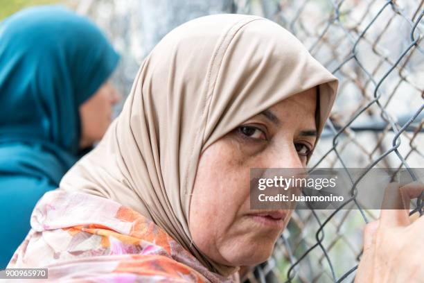sad refugee - religious veil stock pictures, royalty-free photos & images