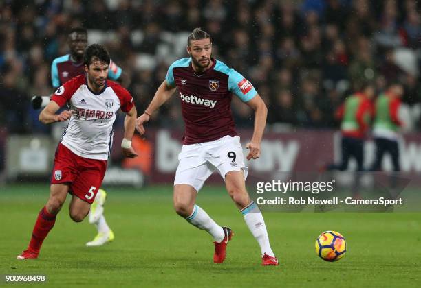West Ham United's Andy Carroll and West Bromwich Albion's Claudio Yacob during the Premier League match between West Ham United and West Bromwich...
