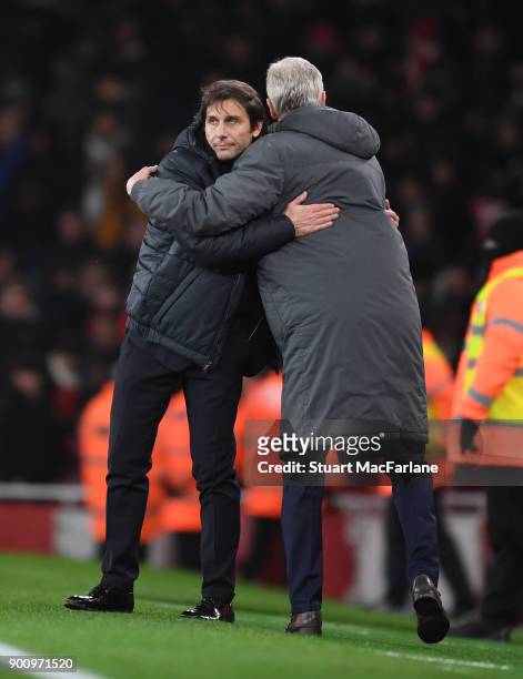 Managers Arsene Wenger of Arsenal and Antonio Conte hug after the Premier League match between Arsenal and Chelsea at Emirates Stadium on January 3,...