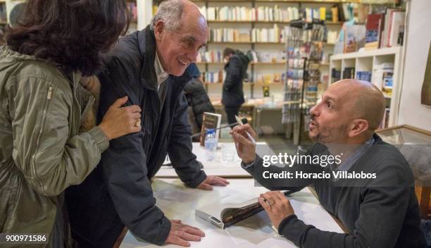 Spanish novelist and essayist Jorge Carrion signs copies of the Portuguese edition of his last book "Livrarias" at the end of his talk about it at...