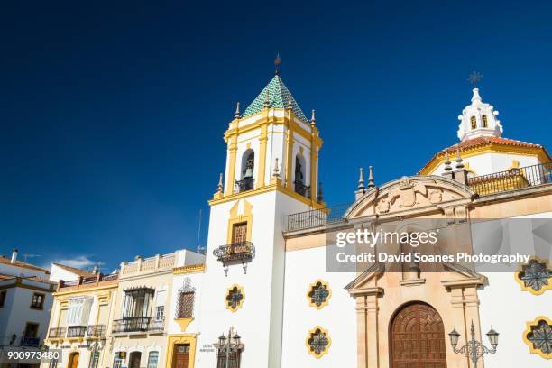 towers of the church parroquia de nuestra señora del socorro in plaza de socorro, ronda, andalucia, spain - ronda fotografías e imágenes de stock