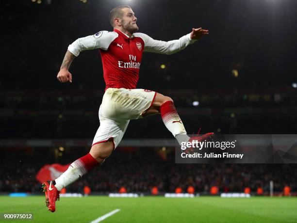 Jack Wilshire of Arsenal celebrates scoring his teams first goal during the Premier League match between Arsenal and Chelsea at Emirates Stadium on...