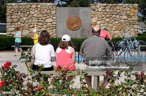 People sit at the John F. Kennedy Memorial August 26, 2009 in Hyannis, Massachusetts. U.S Senator Edward M. Kennedy, younger brother of John F....