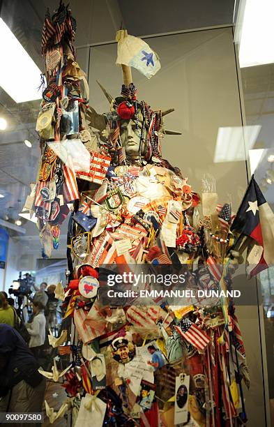 Statue of Liberty replica adorned with memorabilias of victims from the September 11, 2001 terror attacks on the World Trade Center stands at the...