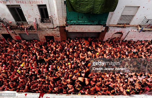 Revellers pelt each other with tomatoes during the world's biggest tomato fight at La Tomatina festival on August 26, 2009 in Bunol, Spain. More than...