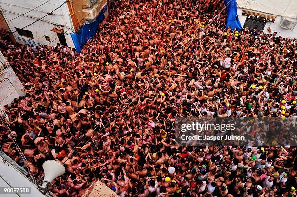 Revellers pelt each other with tomatoes during the world's biggest tomato fight at La Tomatina festival on August 26, 2009 in Bunol, Spain. More than...