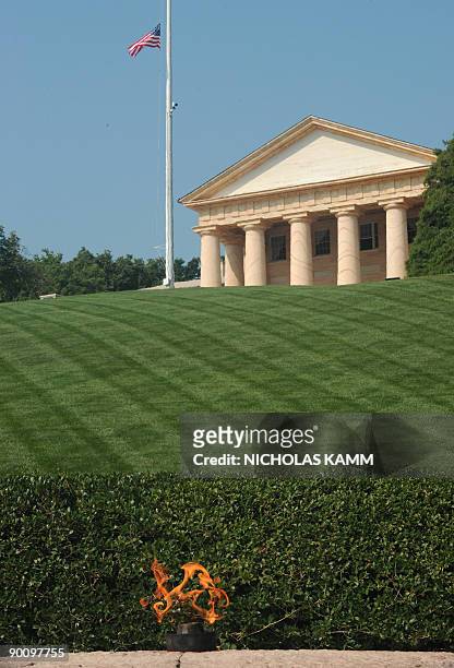 The flame burns on the grave of late US President John F. Kennedy at Arlington National Cemetery outside Washington,DC on August 26 one day after the...