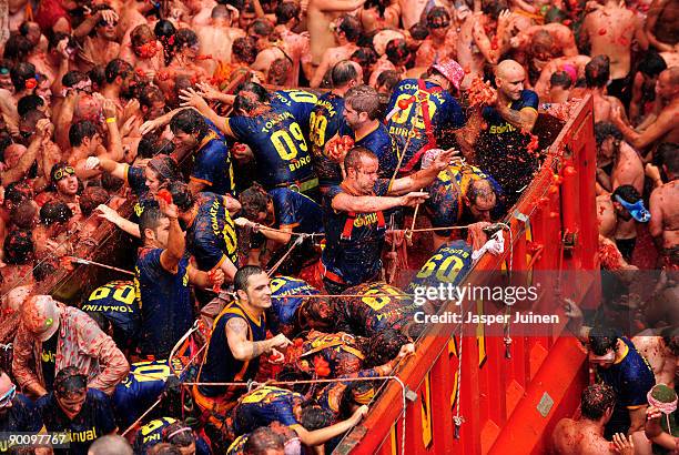 Revellers throw tomatoes during the world's biggest tomato fight at La Tomatina festival on August 26, 2009 in Bunol, Spain. More than 45000 people...