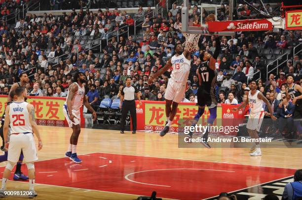 Jamil Wilson of the LA Clippers attempts to block the shot by Garrett Temple of the Sacramento Kings during the game between the two teams on...