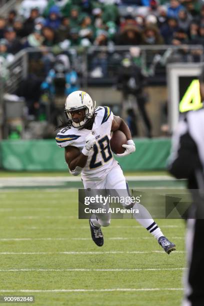 Running Back Melvin Gordon of the Los Angeles Chargers in action against the New York Jets in an NFL game at MetLife Stadium on December 24, 2017 in...