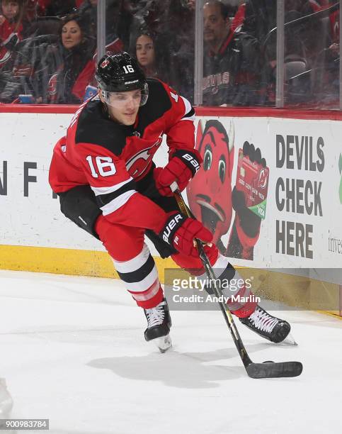 Steven Santini of the New Jersey Devils plays the puck against the Buffalo Sabres during the game at Prudential Center on December 29, 2017 in...