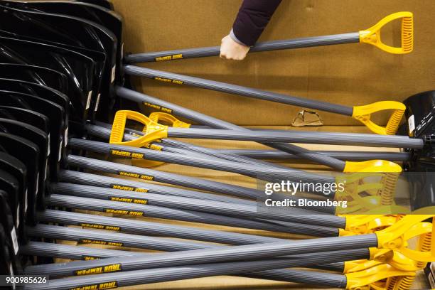 Customer grabs a snow shovel at a Home Depot Inc. Store in Boston, Massachusetts, U.S., on Wednesday, Jan. 3, 2018. The worst winter storm of the...