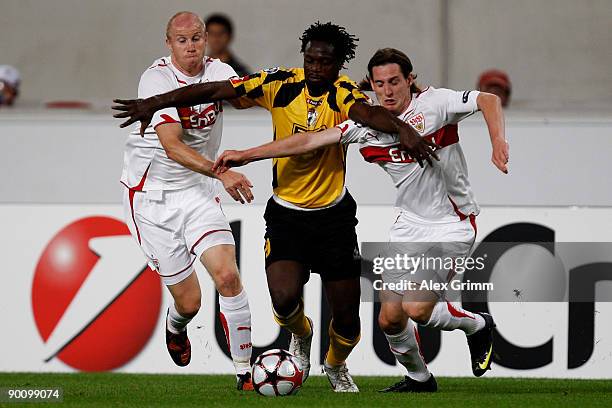 Winston Parks of Timisoara is challenged by Ludovic Magnin and Sebastian Rudy of Stuttgart during the Champions League Qualifier match between VfB...
