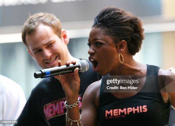 Actors Chad Kimball and Montego Glover perform at the BBQ to celebrate the opening of "Memphis" on Broadway at Shubert Alley on August 26, 2009 in...