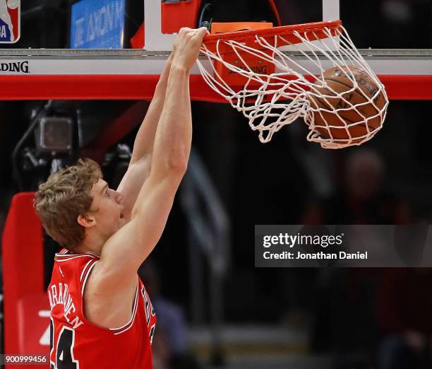 Lauri Markkanen of the Chicago Bulls dunks against the Toronto Raptors at the United Center on January 3, 2018 in Chicago, Illinois. NOTE TO USER:...