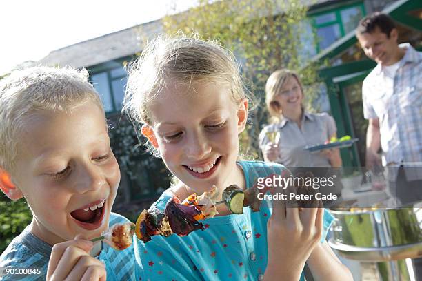 family barbeque, children eating - hot boy body stock pictures, royalty-free photos & images