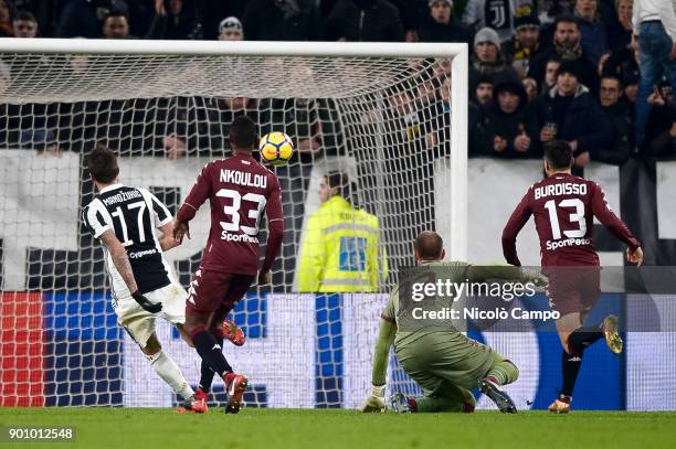 Mario Mandzukic of Juventus FC scores a goal during the TIM Cup football match between Juventus FC and Torino FC. Juventus FC won 2-0 over Torino FC.