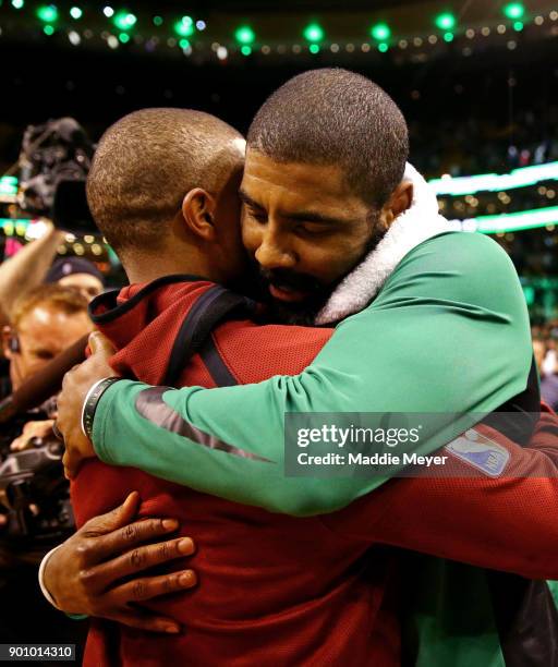 Kyrie Irving of the Boston Celtics hugs Isaiah Thomas of the Cleveland Cavaliers after the Celtics defeat the Cavaliers 102-88 at TD Garden on...