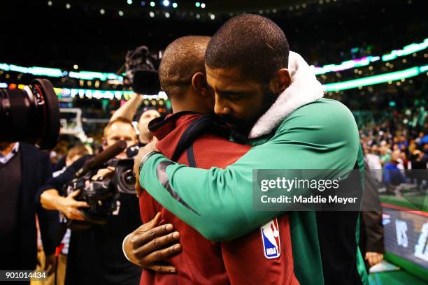 Kyrie Irving of the Boston Celtics hugs Isaiah Thomas of the Cleveland Cavaliers after the Celtics defeat the Cavaliers 102-88 at TD Garden on...