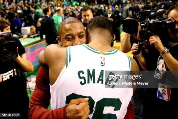 Isaiah Thomas of the Cleveland Cavaliers hugs Marcus Smart of the Boston Celtics after the Celtics defeat the Cavaliers 102-88 at TD Garden on...