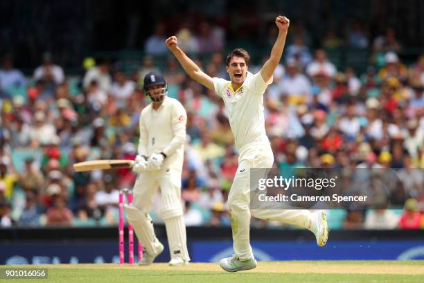 Pat Cummins of Australia celebrates after taking the wicket of James Vince of England during day one of the Fifth Test match in the 2017/18 Ashes...