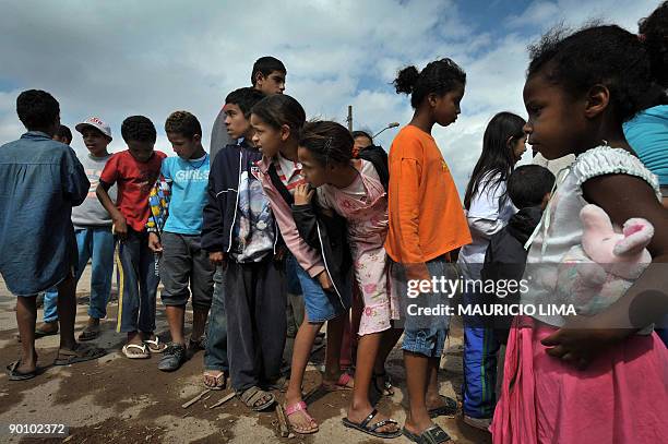 Brazilian homeless families queue up to get food in front of the land they were evicted from, at Capao Redondo shantytown, southern outskirts of Sao...