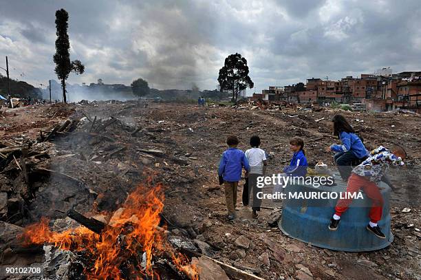 Brazilian homeless children play on the land they were evicted from, at Capao Redondo shantytown, southern outskirts of Sao Paulo, Brazil, on August...