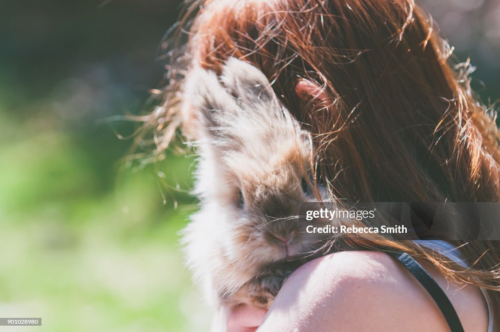 Girl holding a rabbit