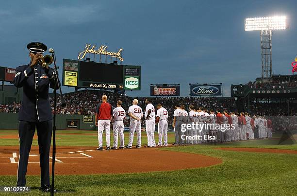 Staff Sgt. Quincy Garner of the US Airforce Band of Liberty plays taps to honor the late Ted Kennedy as the Boston Red Sox and the Chicago White Sox...