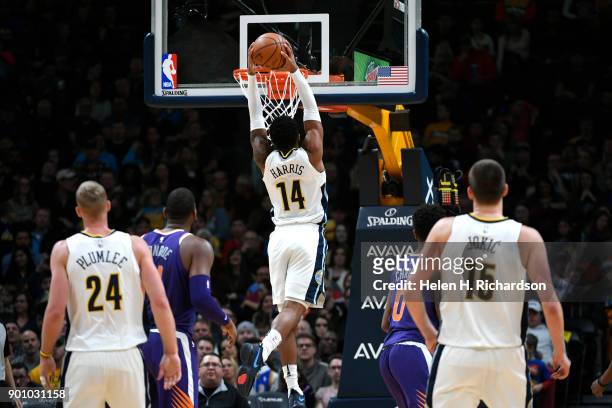Denver Nuggets guard Gary Harris dunks the ball during the first half of an NBA game against the Phoenix Suns at Pepsi Center on January 3, 2018 in...