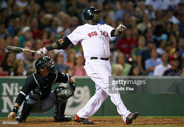 David Ortiz of the Boston Red Sox hits a home run in the first inning during the game against the Chicago White Sox on August 26, 2009 at Fenway Park...