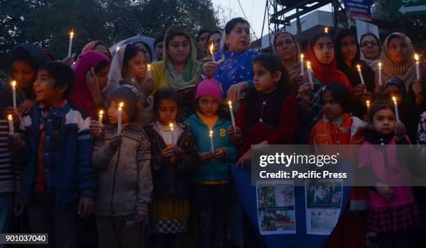 Pakistani students and citizen from different walk hold placards participate in candlelight vigil in memory of Army Public School Peshawar massacres...