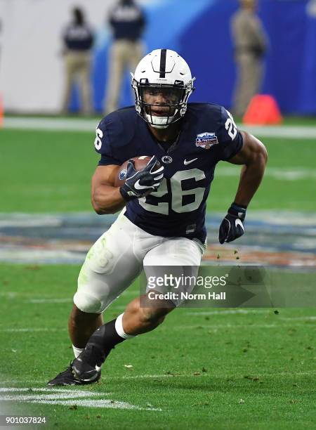 Saquon Barkley of Penn State Nittany Lions runs with the ball against the Washington Huskies during the Playstation Fiesta Bowl at University of...