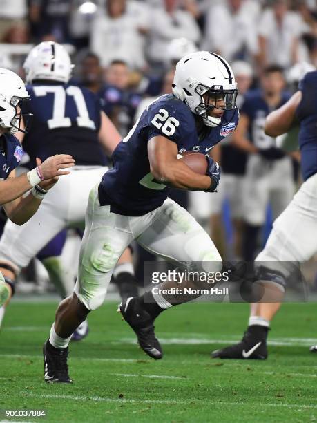 Saquon Barkley of Penn State Nittany Lions rusn with the ball against the Washington Huskies during the Playstation Fiesta Bowl at University of...