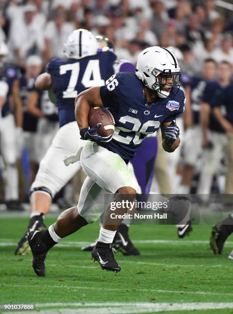 Saquon Barkley of Penn State Nittany Lions rusn with the ball against the Washington Huskies during the Playstation Fiesta Bowl at University of...