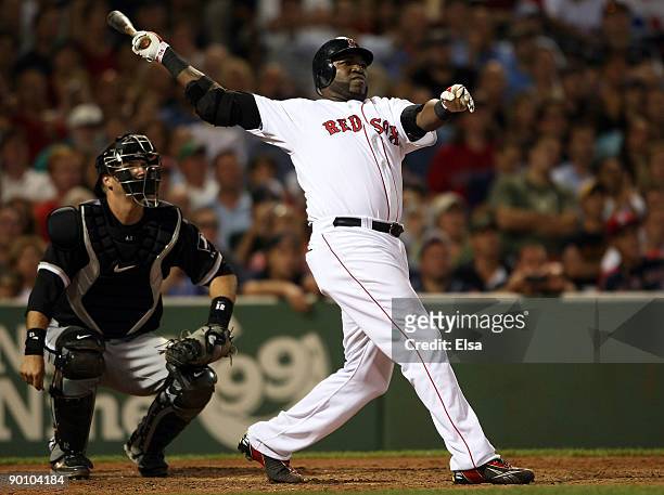 David Ortiz of the Boston Red Sox hits a solo home run at the bottom of the 9th inning to win the game as catcher A.J. Pierzynski of the Chicago...