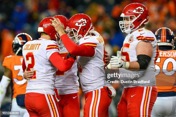 Kansas City Chiefs players including punter Dustin Colquitt celebrate after a game-winning field goal by kicker Harrison Butker of the Kansas City...