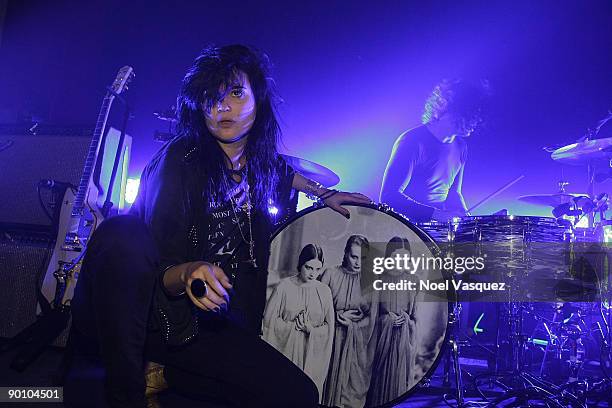 Alison Mosshart and Jack White of The Dead Weather perform at the Third Man Records Pop-Up LA store on August 26, 2009 in Los Angeles, California.