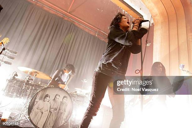 Jacke White, Alison Mosshart and Jack Lawrence of The Dead Weather perform at the Third Man Records Pop-Up LA store on August 26, 2009 in Los...